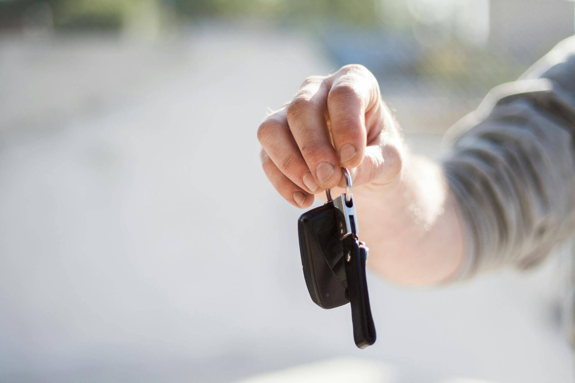 A man holding car keys